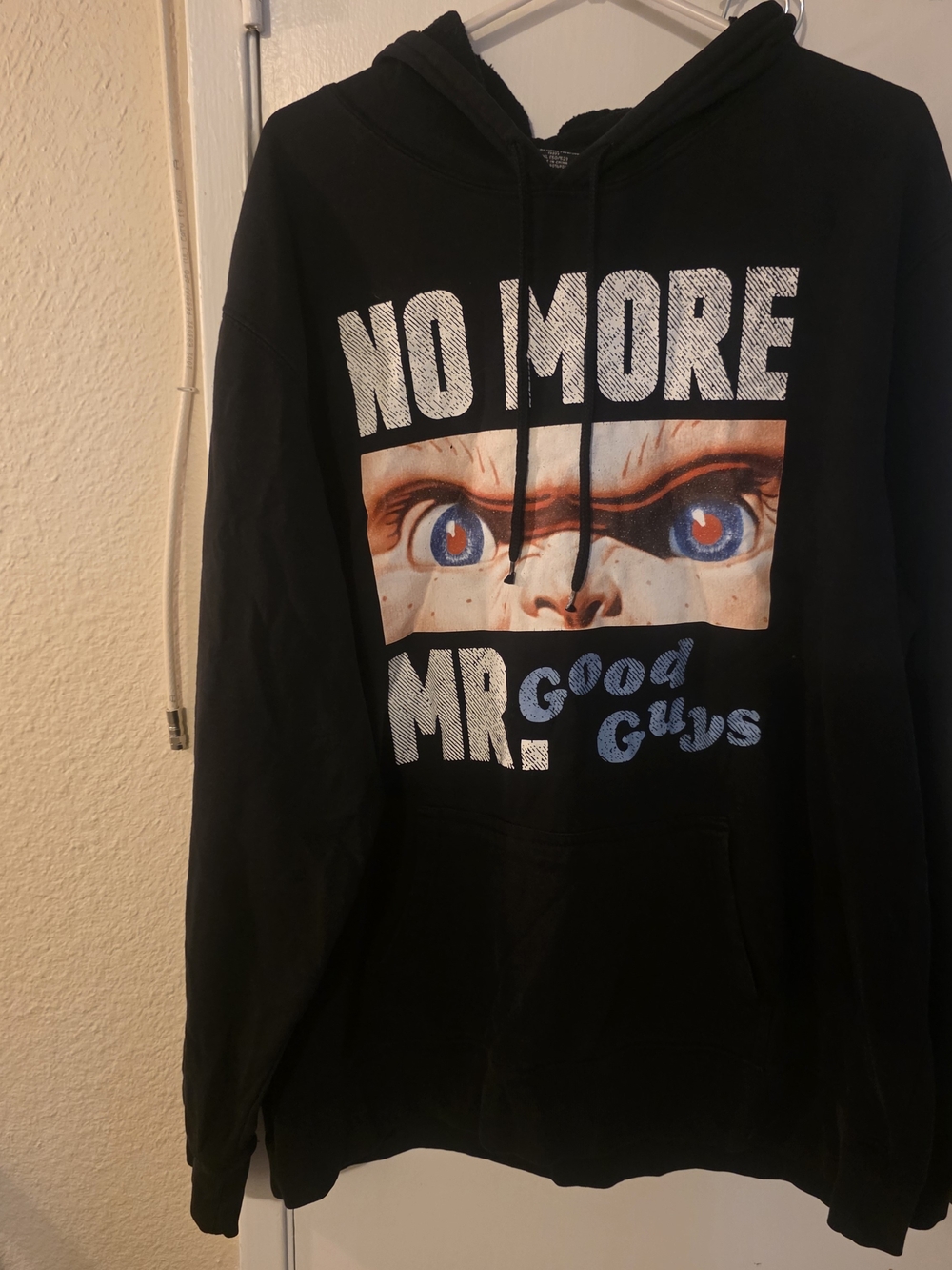 Wanna Play? Black Pullover Hoodie with Bold Eye Graphic